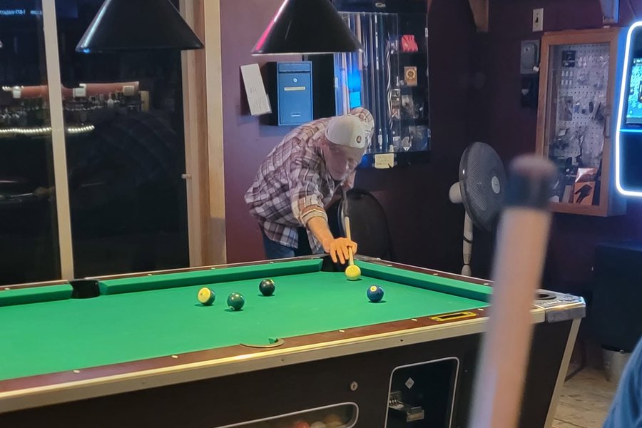 A player lining up a shot at Grumpies